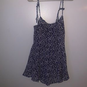 Small Amazon navy blue and white polka dot romper